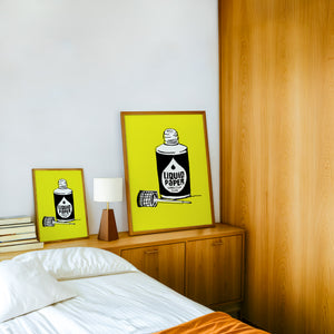 Liquid Paper office wall art print by Betsy Crum — framed in a wood-accent room