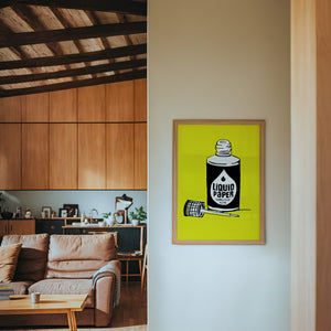 Liquid Paper office wall art print by Betsy Crum — framed in a wood-accent room