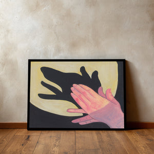 The Dog Shadow Puppet art print by Caya Crum in a sleek black frame leaning against a concrete gallery wall on parquet hardwood floors, showcasing a striking, mid-century minimalist museum vibe.