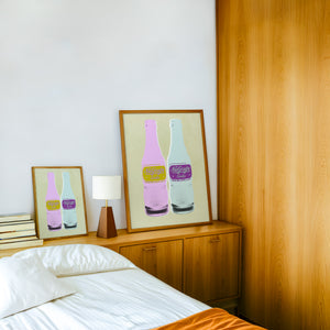 NuGrape Soda kitchen art print by Betsy Crum — framed in a wood-accent room