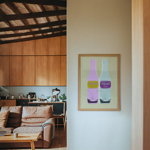 NuGrape Soda kitchen art print by Betsy Crum — framed in a wood-accent room