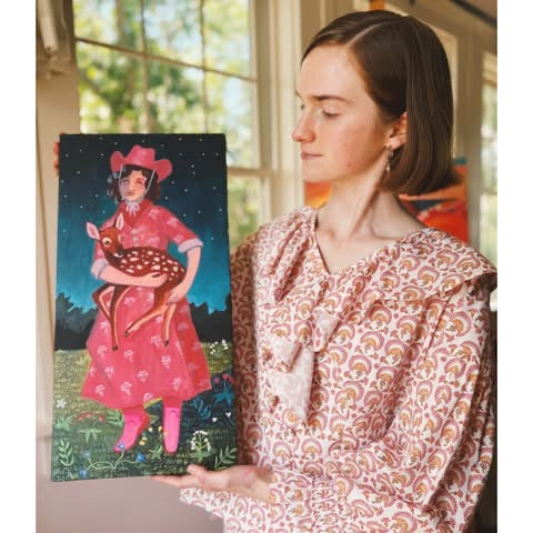 Artist Caya Crum with the original painting Wildflowers