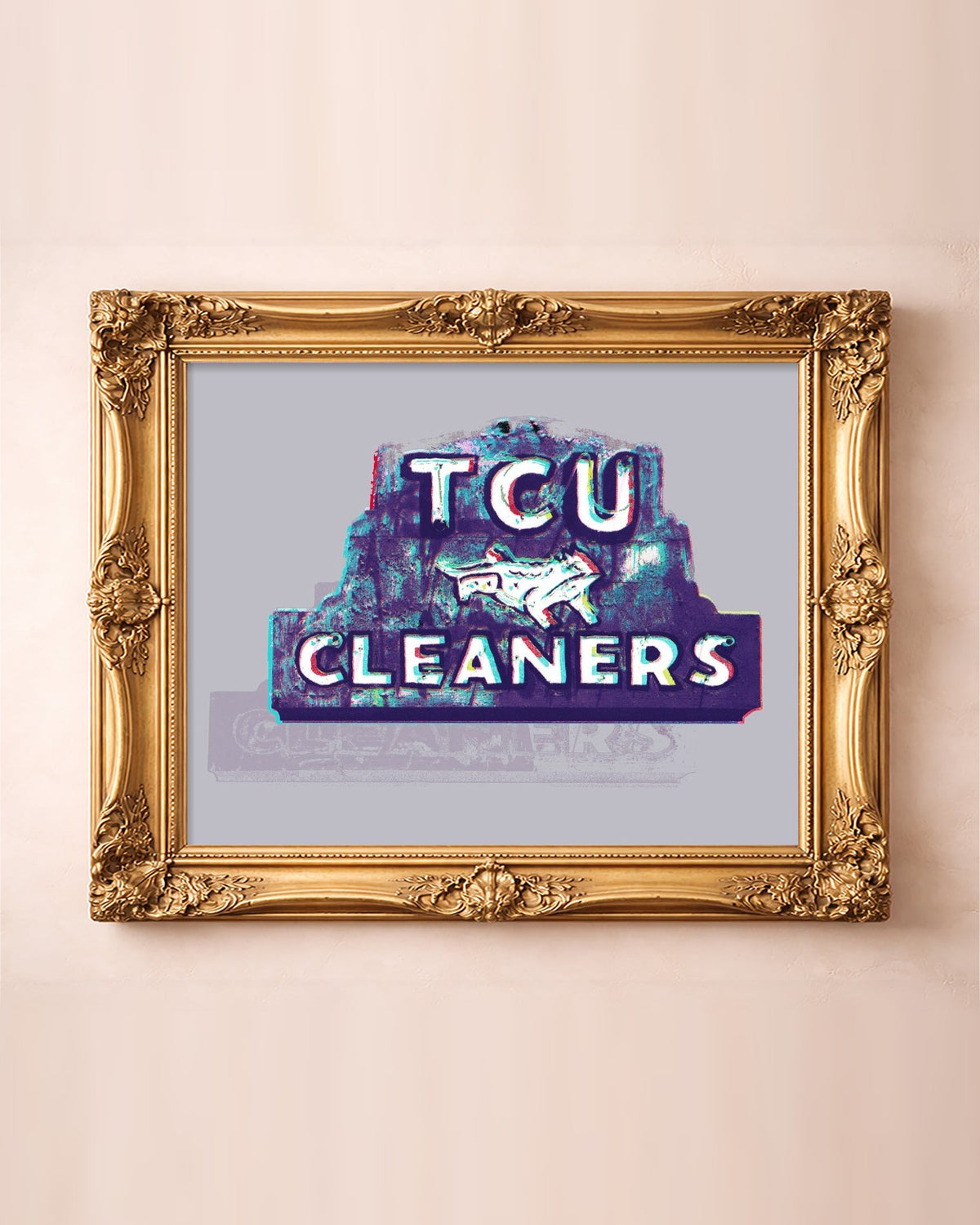 TCU Cleaners sign art print by Betsy Crum in a horizontal gold frame, the purple Fort Worth sign with its leaping horned frog
