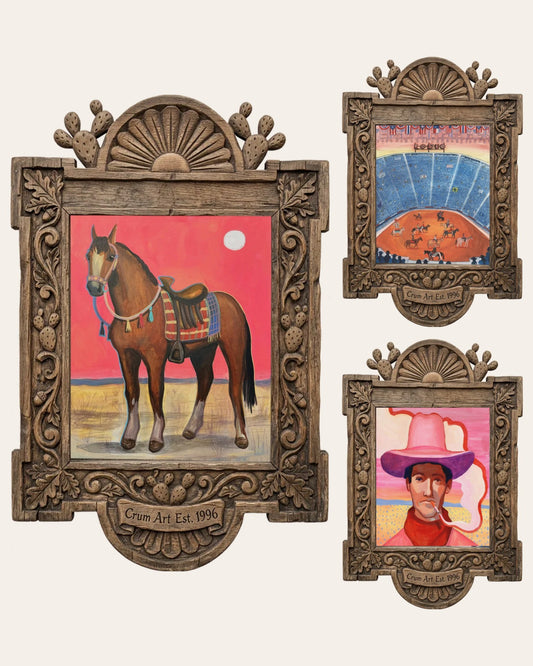 Set of 3 wall art — The Pink Sky Set by Caya Crum: saddled horse under a pink sky, Fort Worth rodeo arena, and pink desert cowboy, all framed