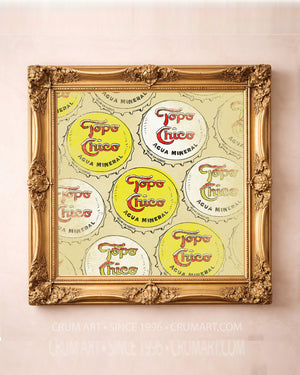 Topo Chico bottle caps art print by Betsy Crum in a square gold frame