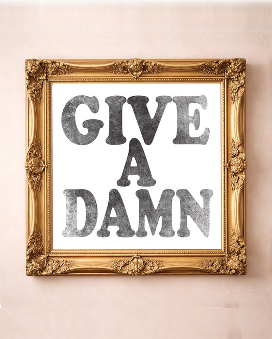Give a Damn, Black on White — typography art print by Betsy Crum in a square gold frame