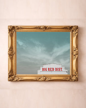 Big Red Building Big Sky Waco art print by Betsy Crum — in a gold frame