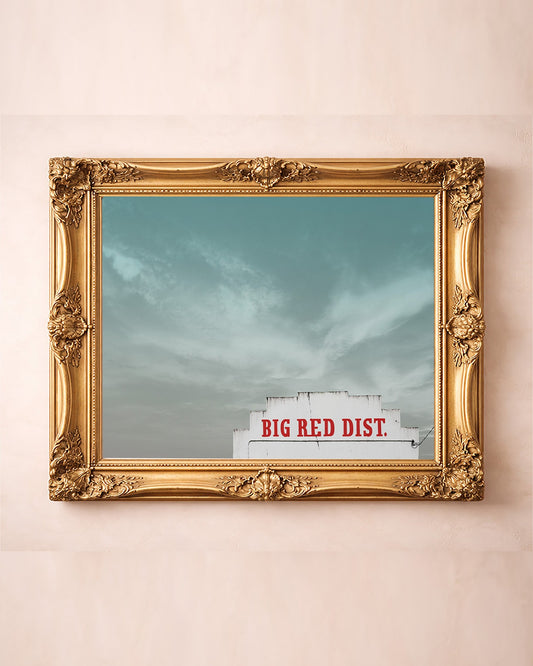 Big Red Building Big Sky Waco art print by Betsy Crum — in a gold frame