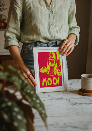 The Judy's Moo Cassette (yellow and red) music wall art print by Betsy Crum — neutral frame room mockup